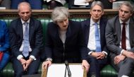 A handout photograph released by the UK Parliament shows Britain's Prime Minister Theresa May (C) making a statement in the House of Commons in London on January 15, 2019 directly after MPs rejected the government's Brexit deal. AFP/ Jessica Taylor / UK P