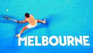 Spain’s Rafael Nadal hits a return against Australia’s Matthew Ebden during their men’s singles match on day three of the Australian Open in Melbourne, yesterday.