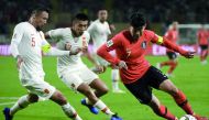 China’s defender Linpeng Zhang (left) fights for the ball with South Korea’s forward Son Heung-min during the 2019 AFC Asian Cup Group C match at the Al Nahyan Stadium in Abu Dhabi, yesterday.