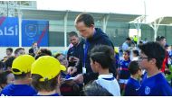 PSG coach Thomas Tuchel signs autographs for fans during the Qatar Tour 2019.  