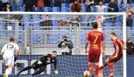 AS Roma Serbian defender Aleksandar Kolarov (R) scores a penalty kick past Torino's Italian goalkeeper Salvatore Sirigu (2ndL) during the Italian Serie A football match AS Roma vs Torino on January 19, 2019 at the Olympic stadium in Rome. / AFP / Vincenzo