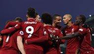 Liverpool's Egyptian midfielder Mohamed Salah (C) celebrates with teammates after scoring their third goal during the English Premier League football match between Liverpool and Crystal Palace at Anfield in Liverpool, north west England on January 19, 201