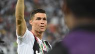 Juventus' Portuguese forward Cristiano Ronaldo greets the fans following the Supercoppa Italiana final between Juventus and AC Milan at the King Abdullah Sports City Stadium in Jeddah on January 16, 2019. / AFP / Fayez Nureldine