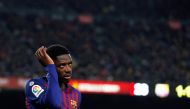 Barcelona's Ousmane Dembele leaves the pitch after sustaining an injury REUTERS/Albert Gea 