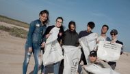 Students during a beach cleanup campaign.