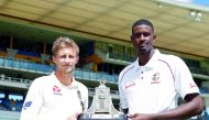 England's Joe Root and West Indies' Jason Holder pose for a photo with the trophy (Action Images via Reuters/Paul Childs) 