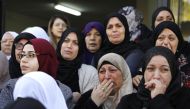 Mourners cry during the funeral of Arab-Israeli student Aya Maasarwe in the Arab-Israeli town of Baqa al-Gharbiya on January 23, 2019. AFP / Ahmad Gharabli  