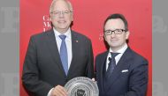 Michael Trick (left) Dean of Carnegie Mellon University in Qatar, presenting a token of recognition to Neil J Walsh, Chief Cybercrime and Anti-Money Laundering Section at UNODC, during a lecture on ‘Cyber Crimes Challenges and Prevention’, held at Carnegi