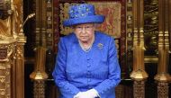 In this file photo taken on June 21, 2017 Britain's Queen Elizabeth II attends the State Opening of Parliament in the House of Lords at the Houses of Parliament in London on June 21, 2017.  / AFP / POOL / Carl Court 