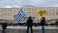 Protesters stand in front of the Greek Parliament in Athens on January 25, 2019.  AFP / Louisa Gouliamaki 