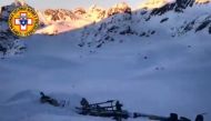 Wreckage of a helicopter after a helicopter and a private plane collided in flight above the Rutor glacier, close to La Thuile, northwestern Italian Alps.  AFP / National Alpine And Speleological Rescue Corps Aosta Valley 