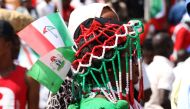 A woman wears People's Democratic Party (PDP) apparel during a campaign rally of Nigerian PDP opposition presidential candidate Atiku Abubakar at the Ahmadu Bello Stadium in Kaduna on January 24, 2019, ahead of Nigeria's general elections of February 16. 