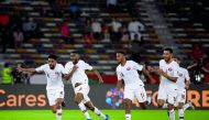 Qatari midfielder Abdelaziz Hatem (second left), celebrates after scoring the winning goal during the 2019 AFC Asian Cup quarter-final football match against South Korea at Zayed Sports City in Abu Dhabi, UAE, yesterday. Qatar won 1-0 to reach the semi-fi