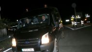 Funeral workers drive a van carrying the body of Julen as they leave the area after the body of the Spanish two-year-old boy who fell into a deep well thirteen days ago when the family was taking a stroll through a private estate was found, in Totalan, so