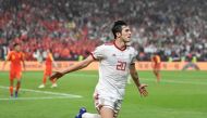 File photo of Iran's forward Sardar Azmoun celebrates his goal during the 2019 AFC Asian Cup quarter-final football match between China and Iran at the Mohammed Bin Zayed Stadium Stadium in Abu Dhabi on January 24, 2019. / AFP / Khaled DESOUKI 