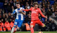 Real Madrid's Croatian midfielder Luka Modric (R) challenges Espanyol's Spanish midfielder Alex Lopez during the Spanish league football match between RCD Espanyol and Real Madrid CF at the RCDE Stadium in Cornella de Llobregat on January 27, 2019. AFP / 