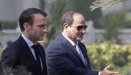 French President Emmanuel Macron (L) and his Egyptian counterpart Abdel Fattah al-Sissi (R) are pictured during a welcome ceremony at the presidential palace in Cairo on January 28, 2019.  AFP / Ludovic MARIN