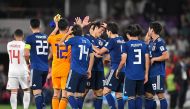 Japan's players celebrate their victory during the 2019 AFC Asian Cup semi-final football match between Iran and Japan at the Hazza Bin Zayed Stadium in Abu Dhabi on January 28, 2019. / AFP / Khaled DESOUKI