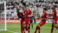 Qatar's Almoez Ali celebrates scoring their second goal with team mates REUTERS/Thaier Al-Sudani
