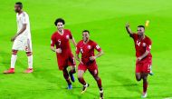 Hamid Ismail (second right) celebrates after scoring Qatar’s fourth goal with team-mates during the Asian Cup semi-final match against UAE in Abu Dhabi yesterday.
