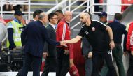 Qatar coach Felix Sanchez Bas shakes hands with United Arab Emirates coach Alberto Zaccheroni at the end of the match, January 29, 2019. REUTERS/Thaier Al-Sudani