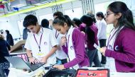The students from different schools in Qatar display prototypes of their engineering design projects to guests at the opening ceremony,