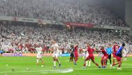 Fans throw bottles and flip-flops at the pitch during the 2019 AFC Asian Cup semi-final football match between Qatar and UAE at the Mohammed Bin Zayed Stadium in Abu Dhabi on January 29, 2019. AFP / Giuseppe Cacace