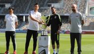 Japan’s Maya Yoshida (left) and head coach Hajime Moriyasu (second left) pose with Qatari captain Hassan Al Haydos (second right) and head coach Felix Sanchez during a photo session at the Zayed Sports City Stadium in Abu Dhabi, yesterday.