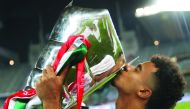 Man-of-the-match, Akram Afif kisses the AFC Asian Cup trophy after Qatar’s historic title win in Abu Dhabi, on Friday. 