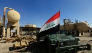 FILE PHOTO:  An Iraqi flag is seen on a military vehicle at an oil field in Dibis area on the outskirts of Kirkuk, Iraq, October 17, 2017. Reuters/Alaa Al-Marjani