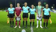 Women FIFA referees pose for a picture with captains of Aspire Academy and Raja Casablanca of Morocco before the Al Kass Cup match at Aspire Academy on Monday. 