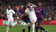 Real Madrid's Karim Benzema in action with Barcelona's Clement Lenglet and Nelson Semedo REUTERS/Sergio Perez 