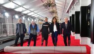 Fifteen-time Grammy winner Alicia Keys (C) joins Neil Portnow (L), Ken Ehrlich (2ndL) Chantal Saucedo (2ndR) and Jack Sussman (R) in the unrolling of the Red Carpet on February 7, 2019 in Los Angeles, California for the 61st Grammy Awards to be held here 