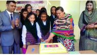 Nargis Raza Otho, Principal of PISQ, cutting a cake to celebrate the Independence Day of Sri Lanka. 