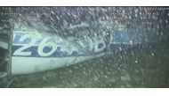 A handout video footage still image released by the UK Air Accidents Investigation Branch (AAIB) shows the rear left side of the fuselage, including part of the aircraft registration, identified as part of the wreckage from the missing Piper Malibu aircra