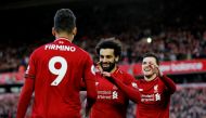 Liverpool's Mohamed Salah celebrates scoring their third goal with Roberto Firmino and Andrew Robertson REUTERS/Phil Noble 