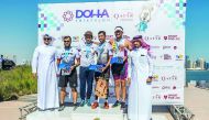 The Podium winners pose for a photograph with officials during the presentation ceremony at the end of the Doha Triathlon on Friday. 