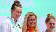 Dutch swimmer Sharon Van Rouwendaal (centre) will return to Doha this week to defend her title. 