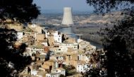 FILE PHOTO: A view of Asco village and a nuclear plant, which uses the waters of the Ebro river water to cool it, in Asco near Tarragona January 27, 2010. REUTERS/Gustau Nacarino/File Photo
