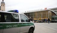 A police vehicle patrols at the main square and in front of the central railway station in Cologne, Germany, January 5, 2016. Reuters/Wolfgang Rattay