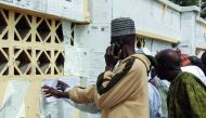 Nigerians check their names against the voters roll in Maiduguri in Borno State in north-eastern Nigeria on February 15, 2019.  AFP / Audu Marte
