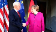 U.S. Vice President Mike Pence shakes hands with German Chancellor Angela Merkel during the annual Munich Security Conference in Munich, Germany February 16, 2019. REUTERS/Michael Dalder