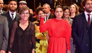 Brazilian actress Bella Camero and members of the casting crew pose on the red carpet before the premiere of the film 
