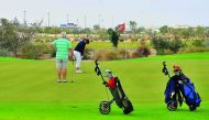 Golfers in action at the practice range of Education City Golf Club during the media familiarisation trip, yesterday. Baher Amin/The Peninsula