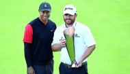 JB Holmes poses for photos with Tiger Woods following his victory of the Genesis Open golf tournament at Riviera Country Club. Credit: Gary A. Vasquez-USA TODAY Sports 

