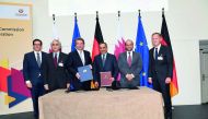above: H E Ali bin Ahmed Al Kuwari, Minister of Commerce and Industry; Thomas Bareiß, Germany’s Parliamentary State Secretary at the Federal Ministry for Economic Affairs and Energy; and other officials pose for a picture. 
