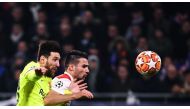 Barcelona's Argentinian forward Lionel Messi (L) and Lyon's French defender Leo Dubois (R) vies for the ball during the UEFA Champions League round of 16 first leg football match between Lyon (OL) and FC Barcelona on February 19, 2019, at the Groupama Sta