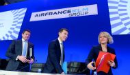Air France-KLM Chief Executive Officer Benjamin Smith (C), KLM President and CEO Pieter Elbers (L) and Air France CEO Anne Rigail (R) leave after attending the press conference for the group's 2018 financial year results in Paris on February 20, 2019. AFP