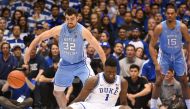 Duke Blue Devils forward Zion Williamson (1) reacts after falling while driving to the basket as North Carolina Tar Heels forward Luke Maye (32) defends during the first half at Cameron Indoor Stadium. Rob Kinnan-USA TODAY Sports