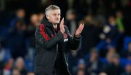 Manchester United's Norwegian caretaker manager Ole Gunnar Solskjaer applauds supporters on the pitch after the English FA Cup fifth round football match between Chelsea and Manchester United at Stamford Bridge in London on February 18, 2019. AFP / Ian Ki